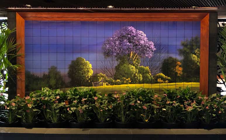 Curtis Wilson Cost painting Eastern Exposure on the welcome wall at Kahului airport, Maui